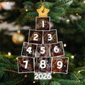 Family Christmas photo ornament hanging on Christmas tree