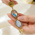 Custom graduation memorial charm featuring photo frame and angel wing pendant