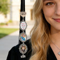 Personalized memorial graduation charm attached to graduation tassel