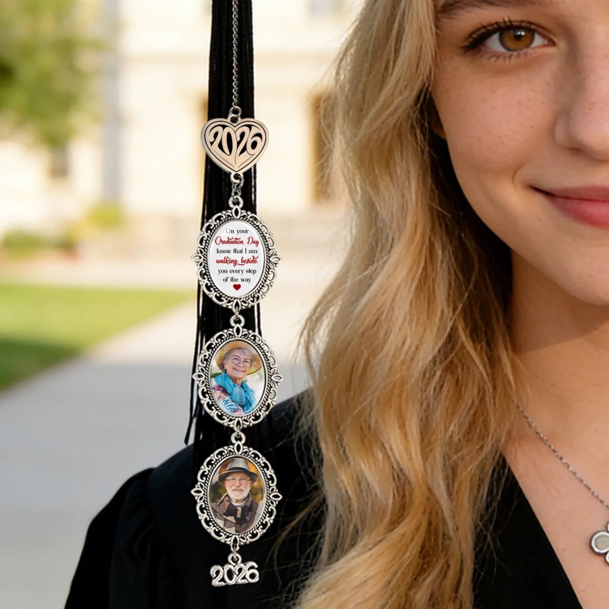 Personalized memorial graduation charm attached to graduation tassel