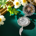 Custom memorial car charm displayed in a floral remembrance setting