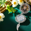 Custom remembrance car charm displayed in a memorial floral setting