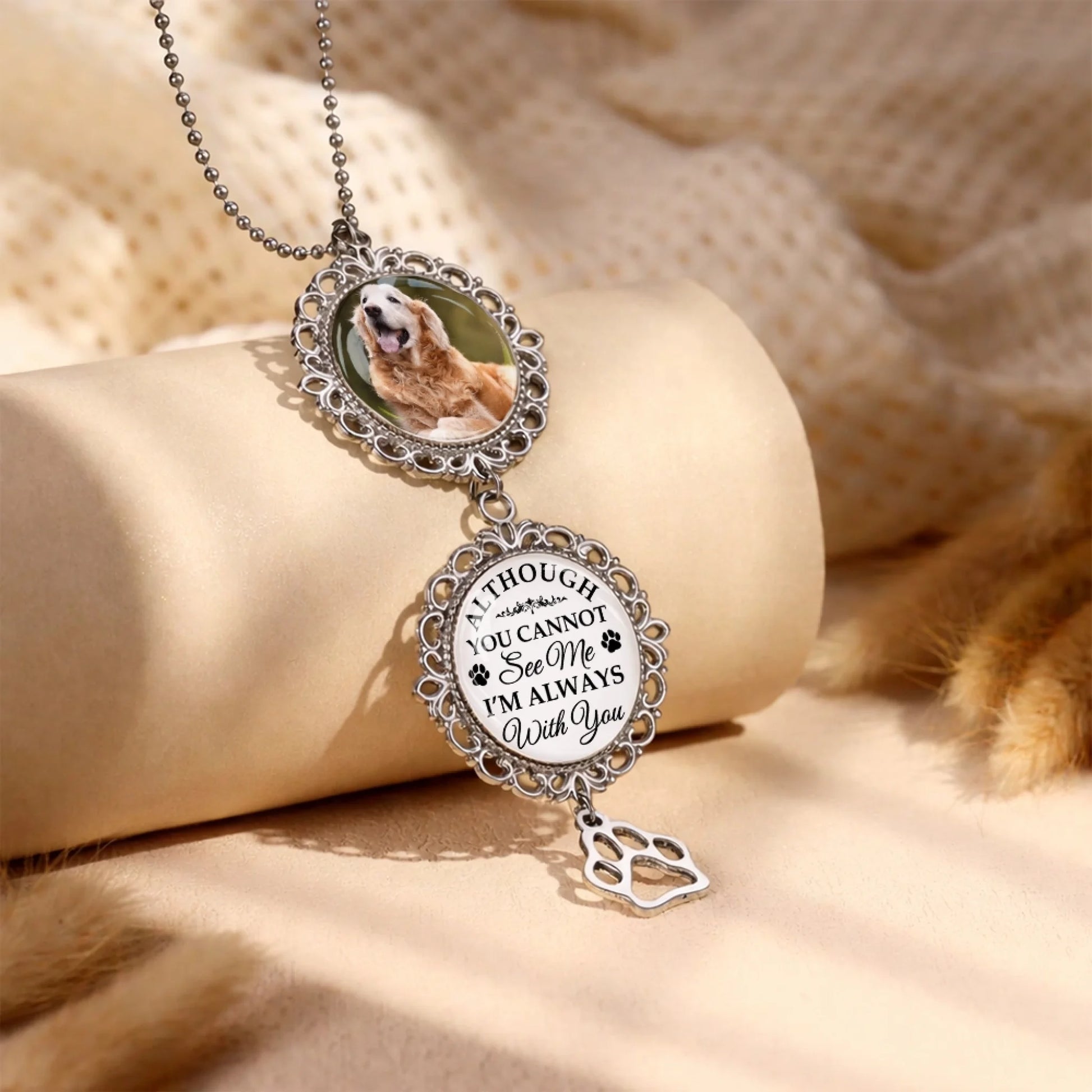 Custom remembrance car charm with photo pendant displayed on fabric background