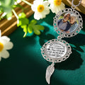 Personalized memorial ornament displayed in a floral remembrance setting