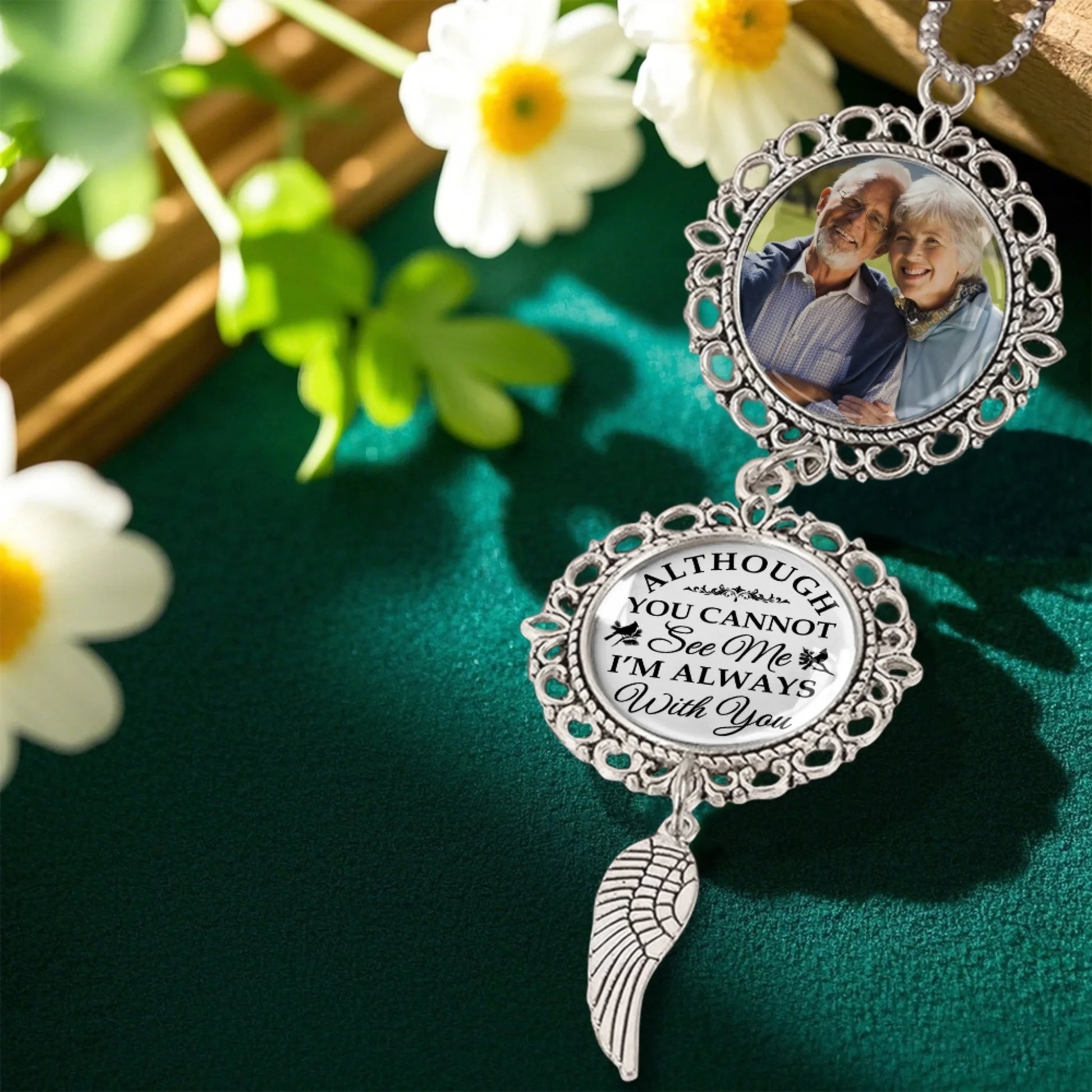 Personalized memorial ornament displayed in a floral remembrance setting
