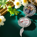 Personalized memorial ornament displayed in a floral remembrance setting