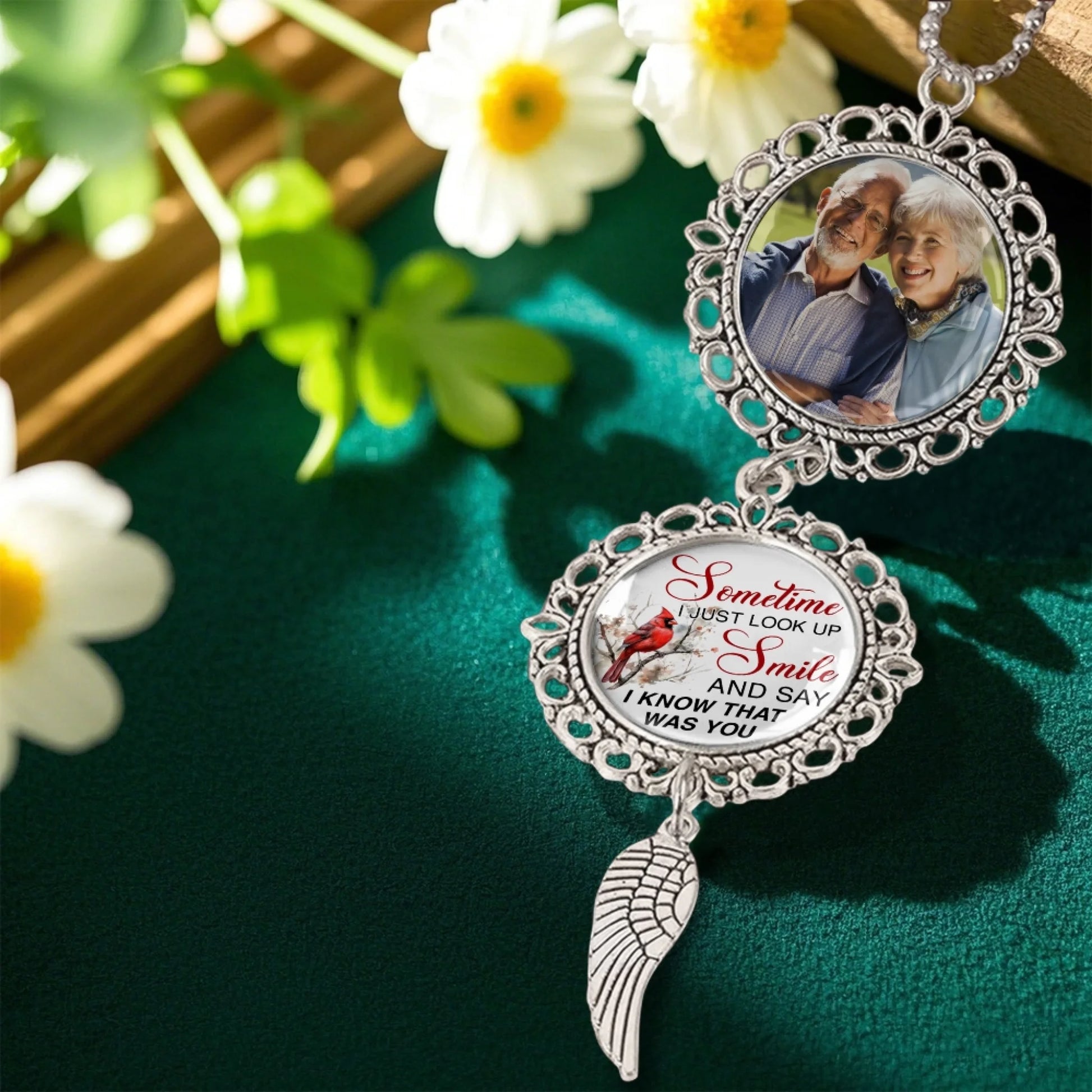 Personalized memorial ornament displayed in a floral remembrance setting
