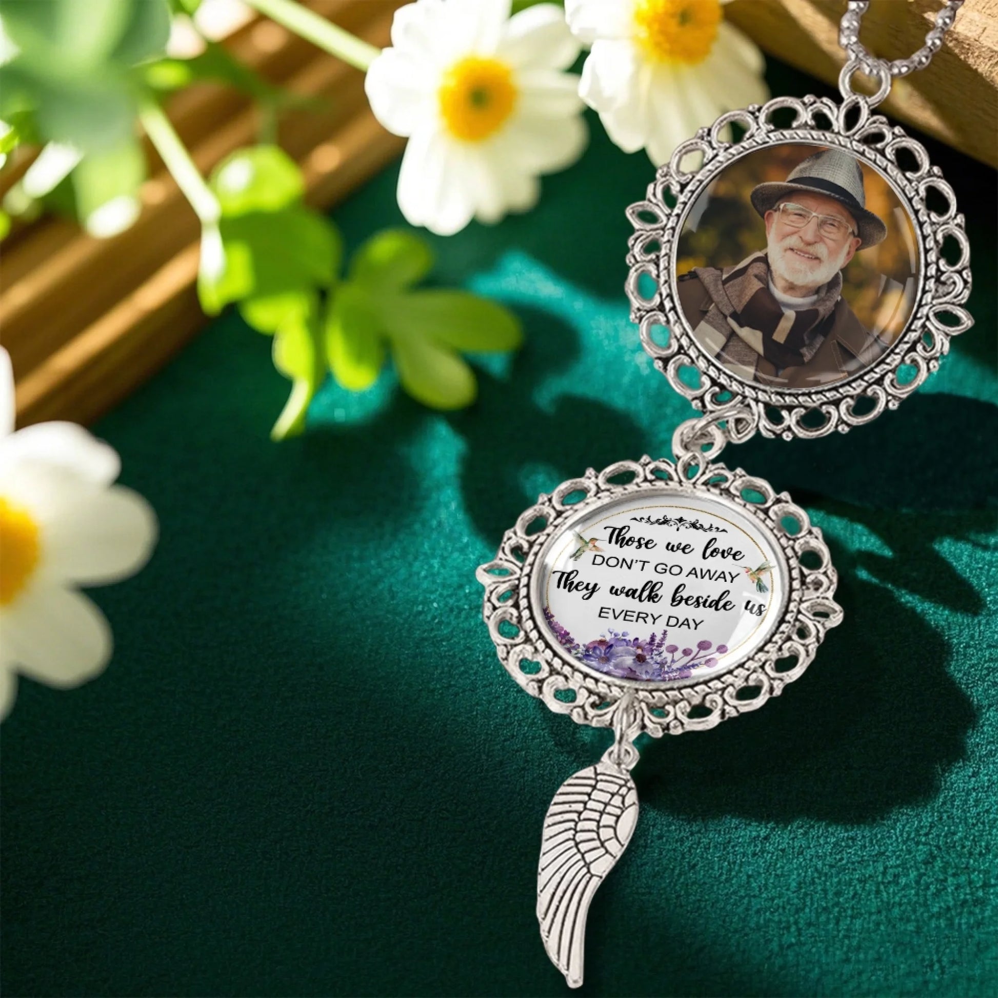 Custom memorial photo charm displayed in a remembrance floral setting