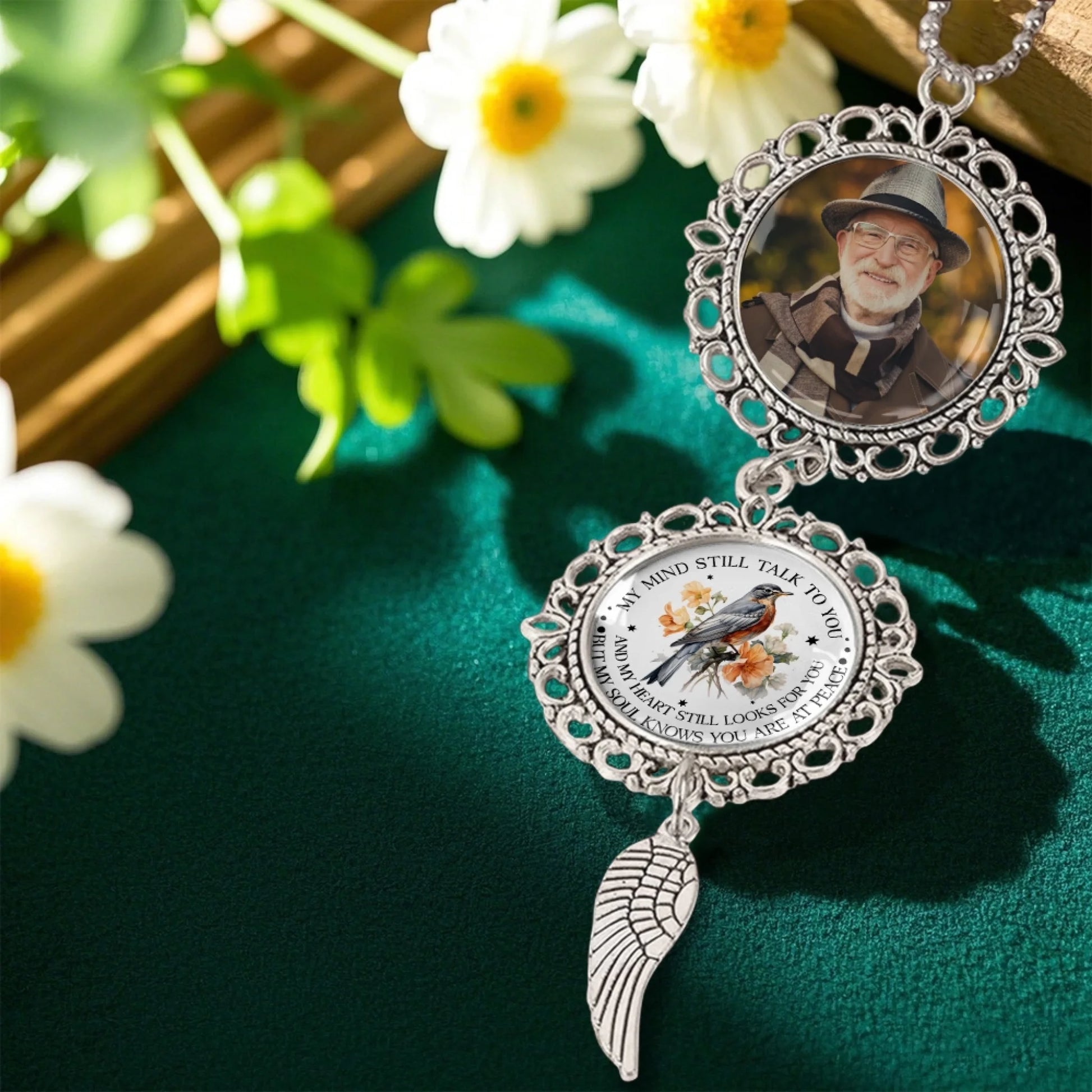 Custom remembrance photo ornament displayed in floral setting