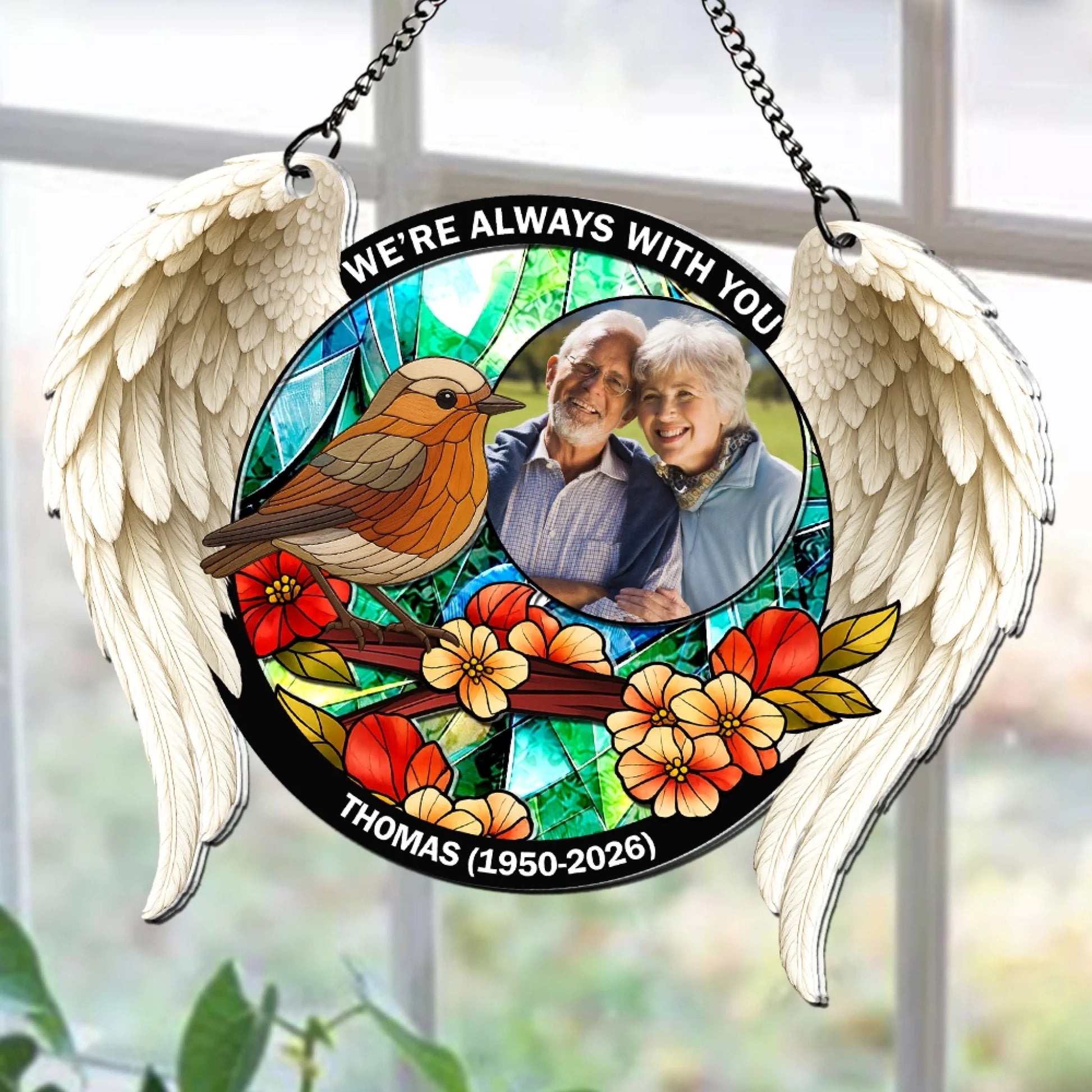 Custom memorial cardinal suncatcher hanging in window