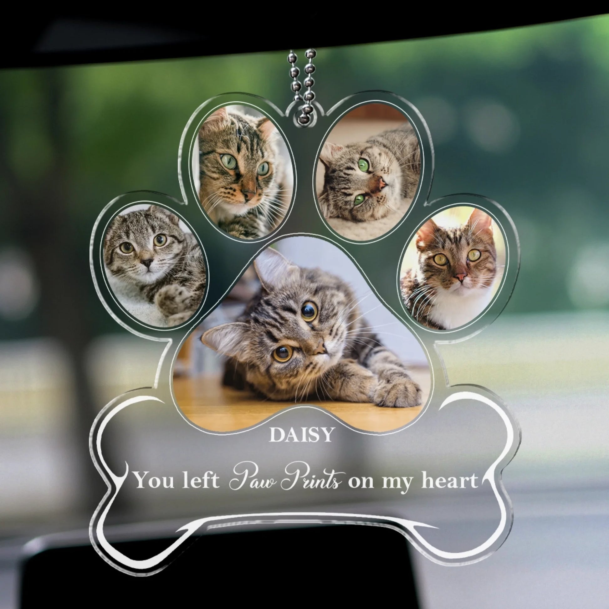 Personalized pet remembrance ornament hanging from vehicle mirror