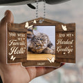 Custom pet remembrance ornament displayed in hand with personalized photo