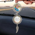 Memorial ornament hanging from vehicle rearview mirror