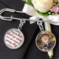 Graduation memorial lapel pin displayed beside flowers and remembrance keepsakes
