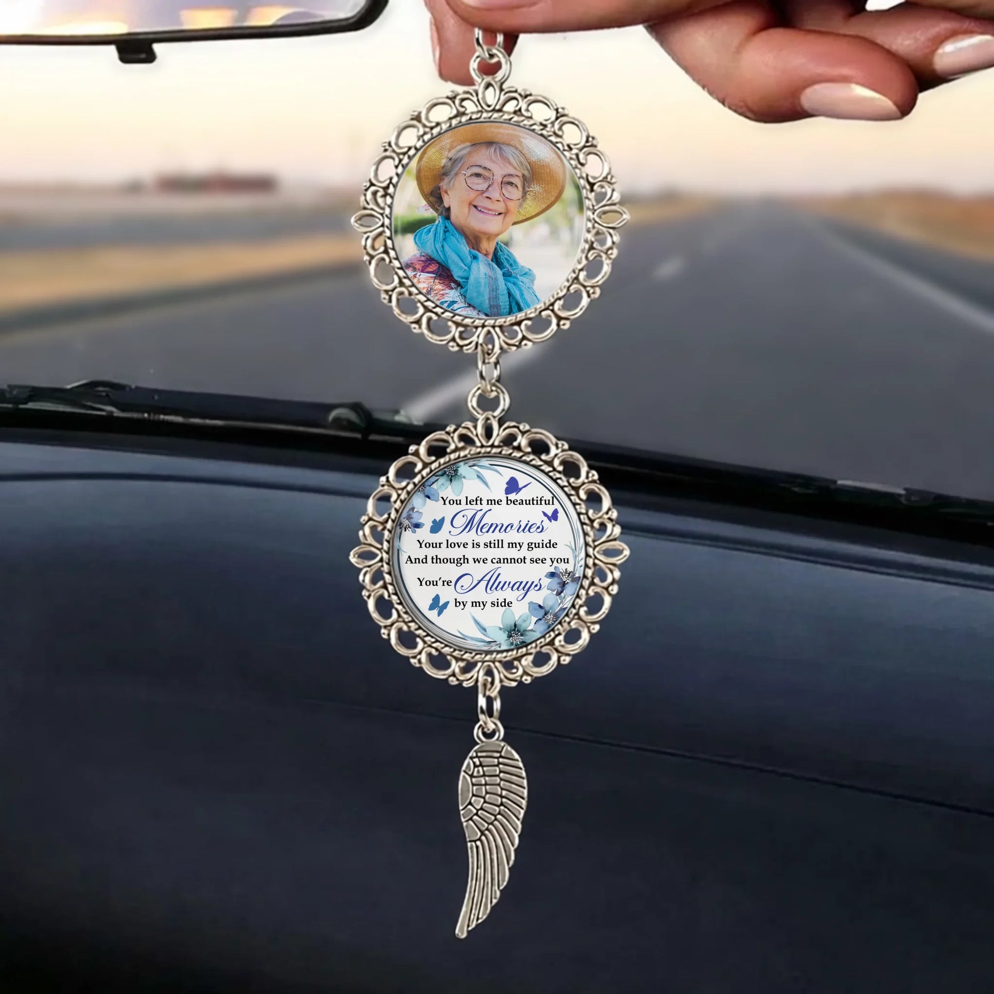 Personalized memorial ornament hanging from a vehicle mirror