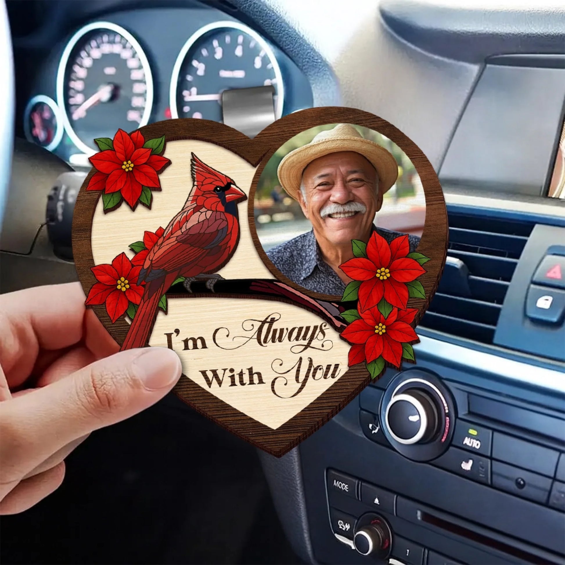 Personalized photo memorial visor clip displayed inside vehicle