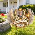 Angel wings memorial garden stake with grandma photo on a front lawn