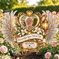 Memorial garden stake with grandpa photo and lilies among pink roses