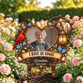 Memorial garden stake with grandma photo and I Have an Angel quote among roses