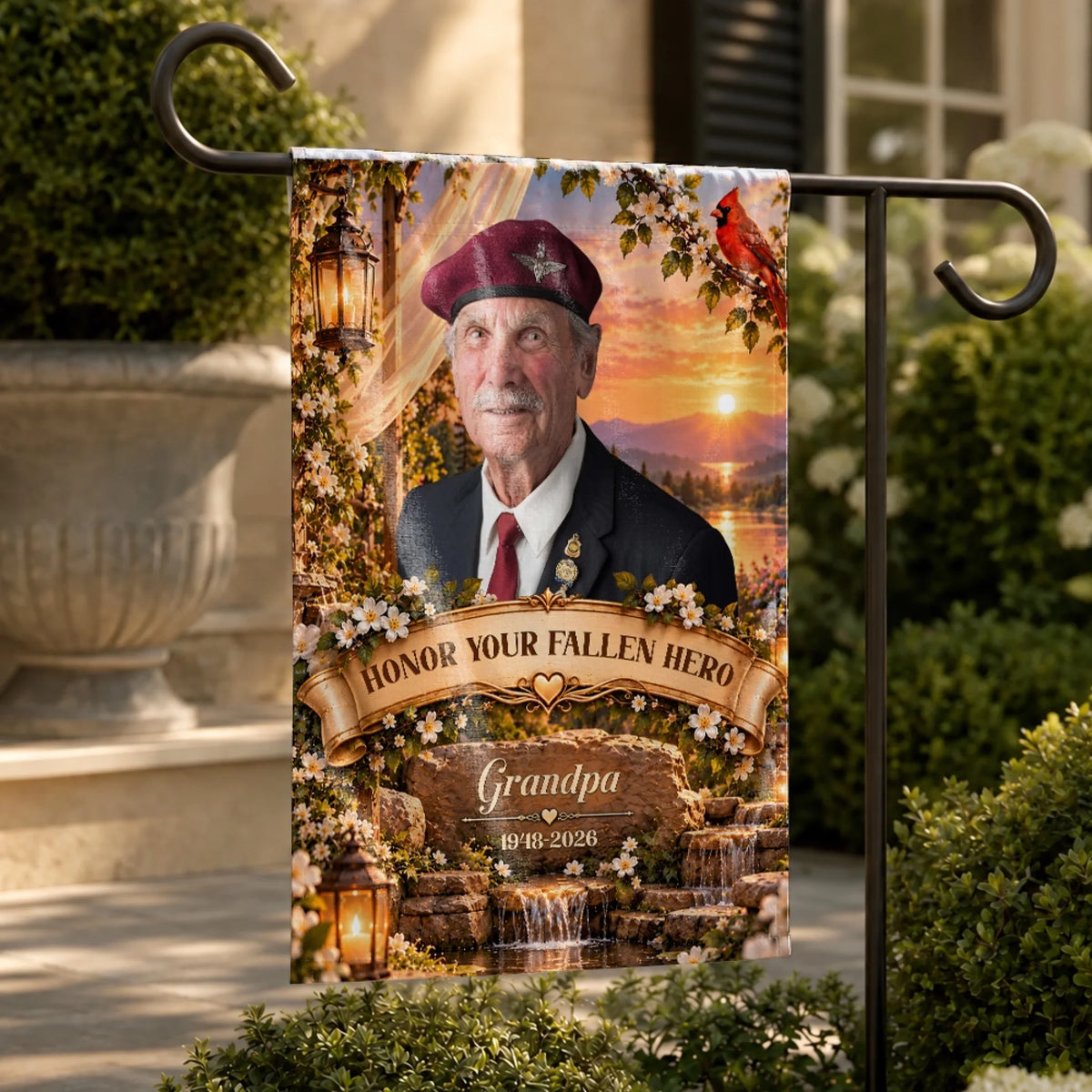 Sunset waterfall memorial garden flag with photo on a stand beside a stone planter