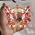 Hand holding red butterfly cross car hanger with grandpa photo and family quote