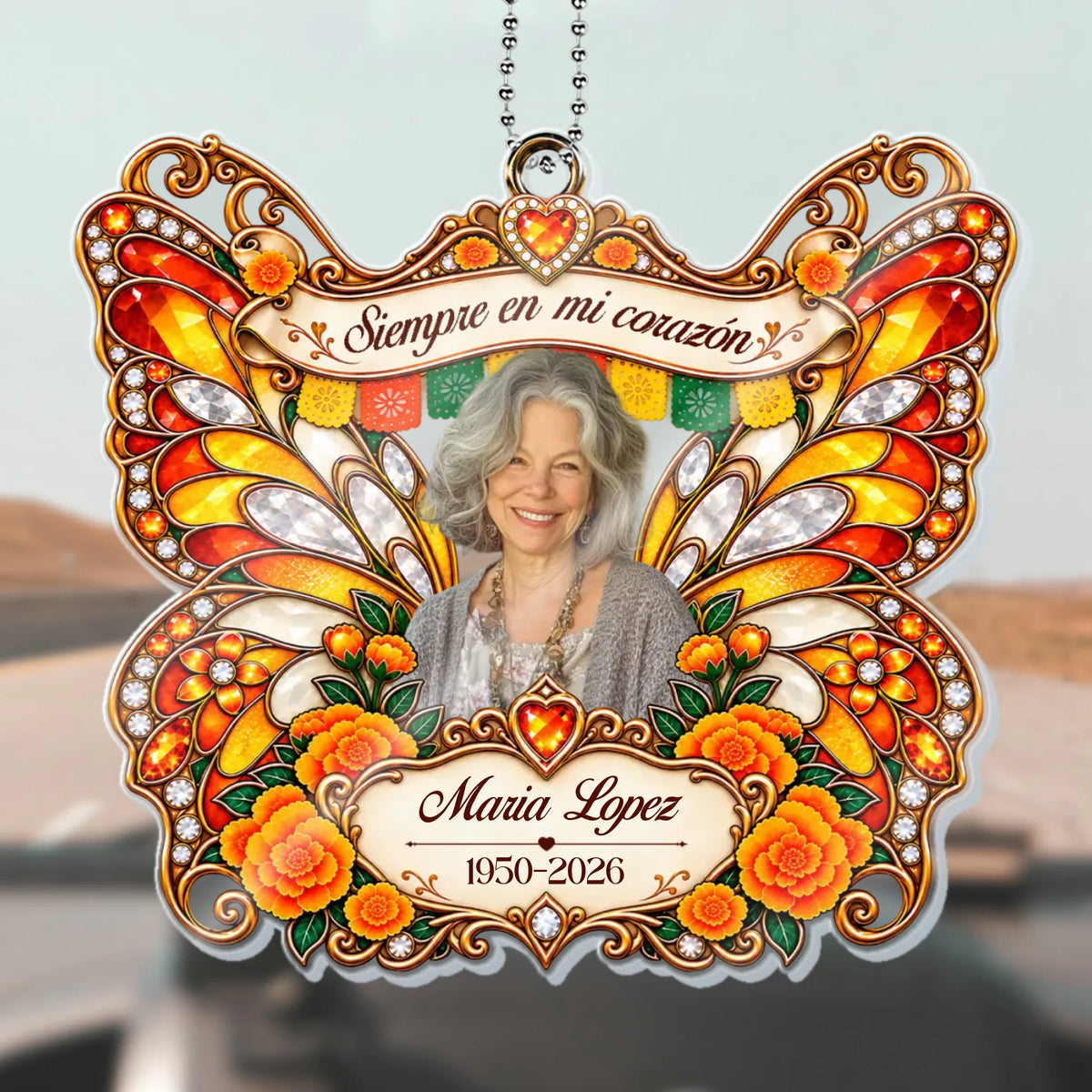 Orange butterfly memorial car hanger with marigolds and Siempre en mi corazón quote