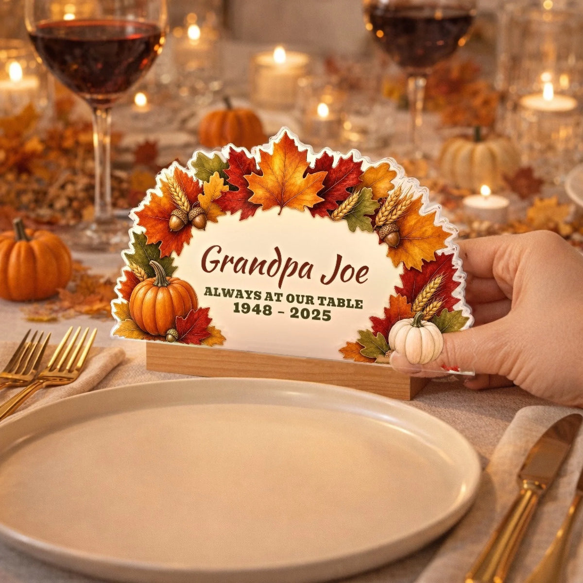 Thanksgiving memorial sign set beside a dinner plate on a holiday table