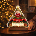 Christmas tree night light with baby photo glowing on a side table