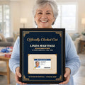 Smiling retiree holding a personalized retirement framed canvas
