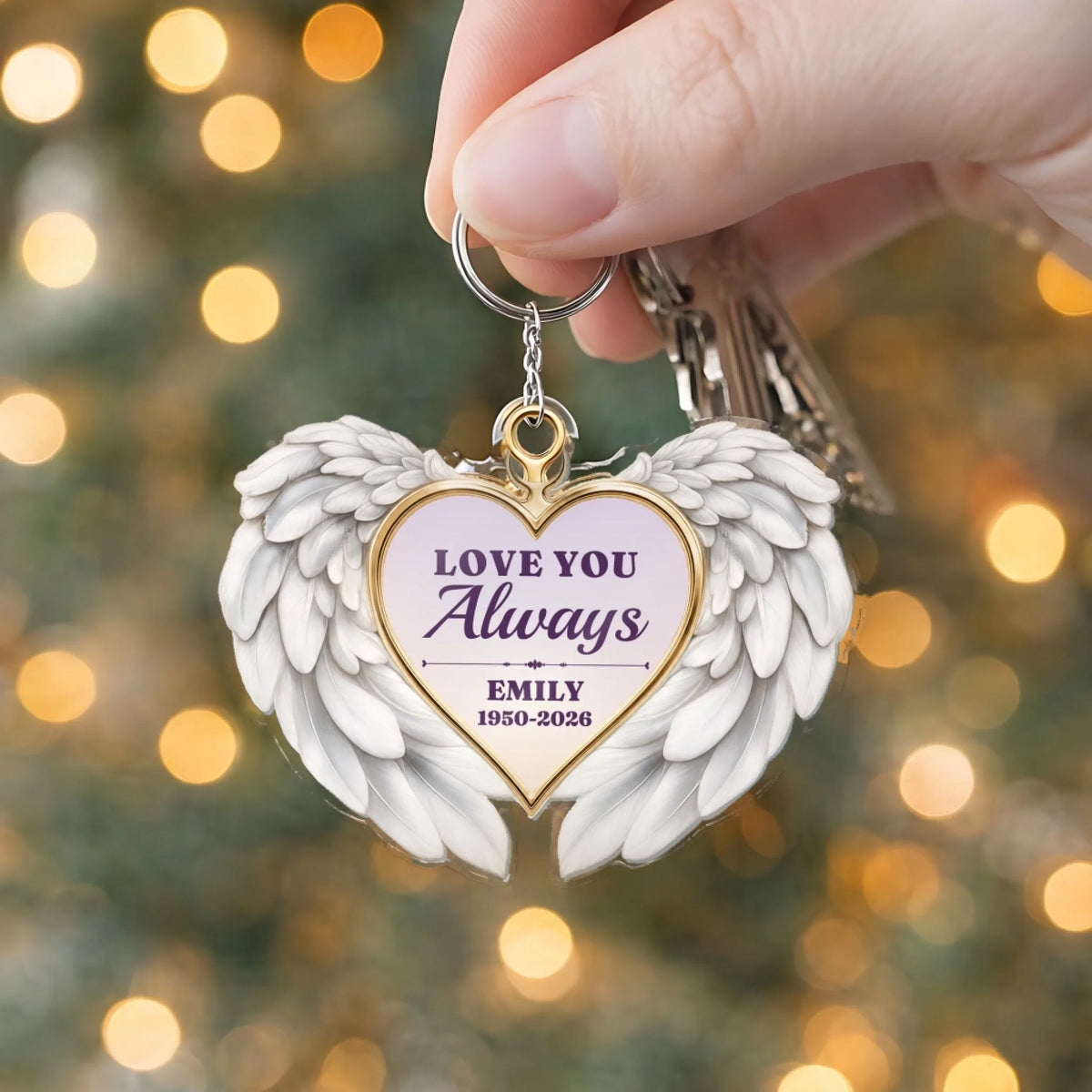 Back of memorial keychain with quote, name and years in a heart