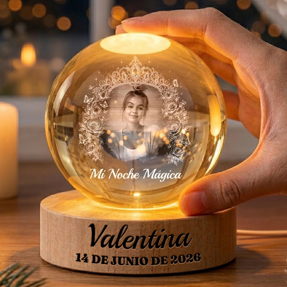 Hand holding a glowing Quinceañera globe lamp with name and date base