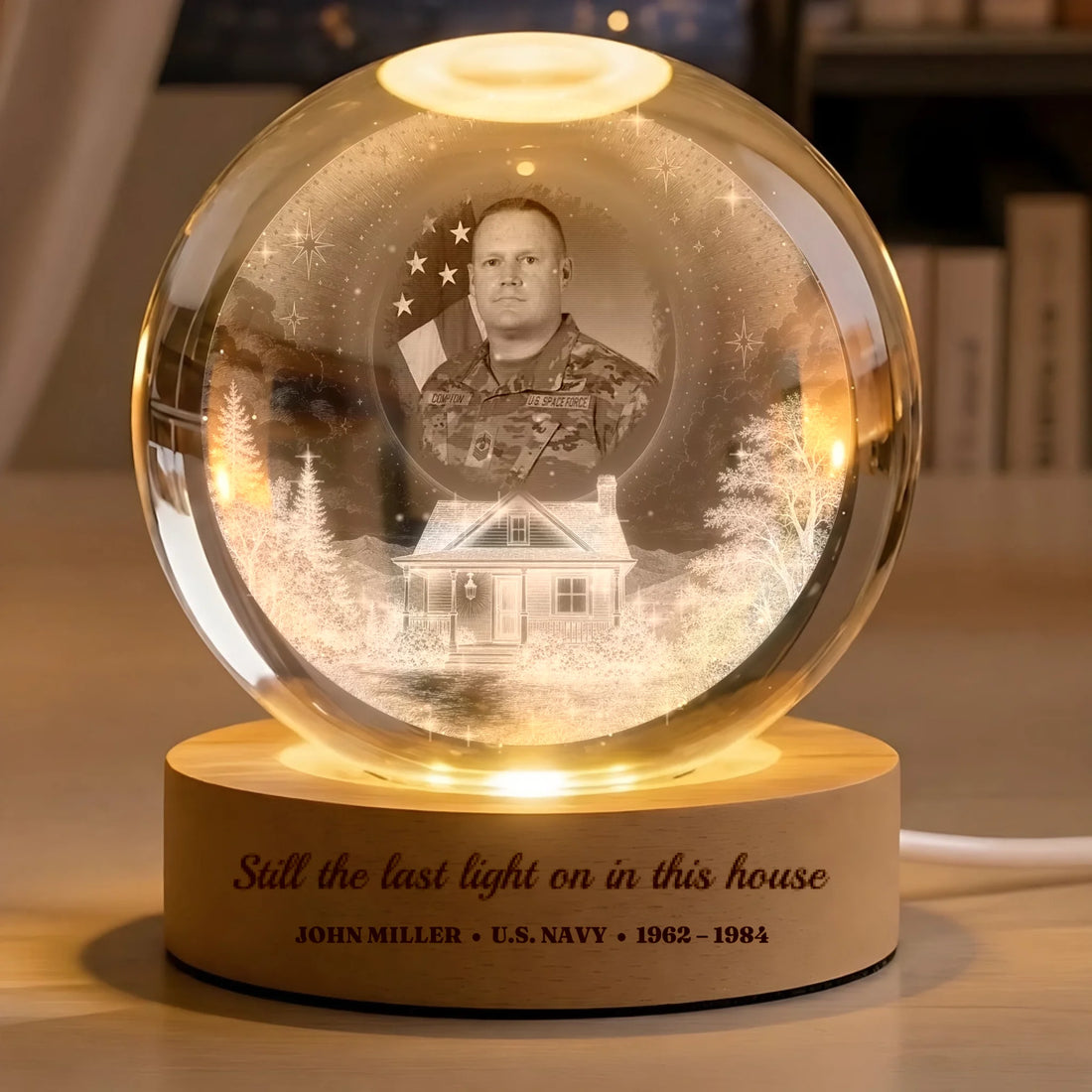 Veteran memorial crystal globe lamp with photo above a snowy home