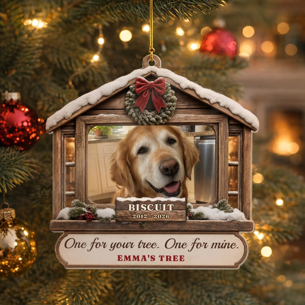 Snowy cabin pet photo ornament hanging on a lit Christmas tree
