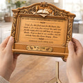 Hands holding personalized grandpa memorial wooden plaque with table grace prayer