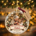 Personalized grandma memorial Christmas ornament with photo hanging on a lit tree