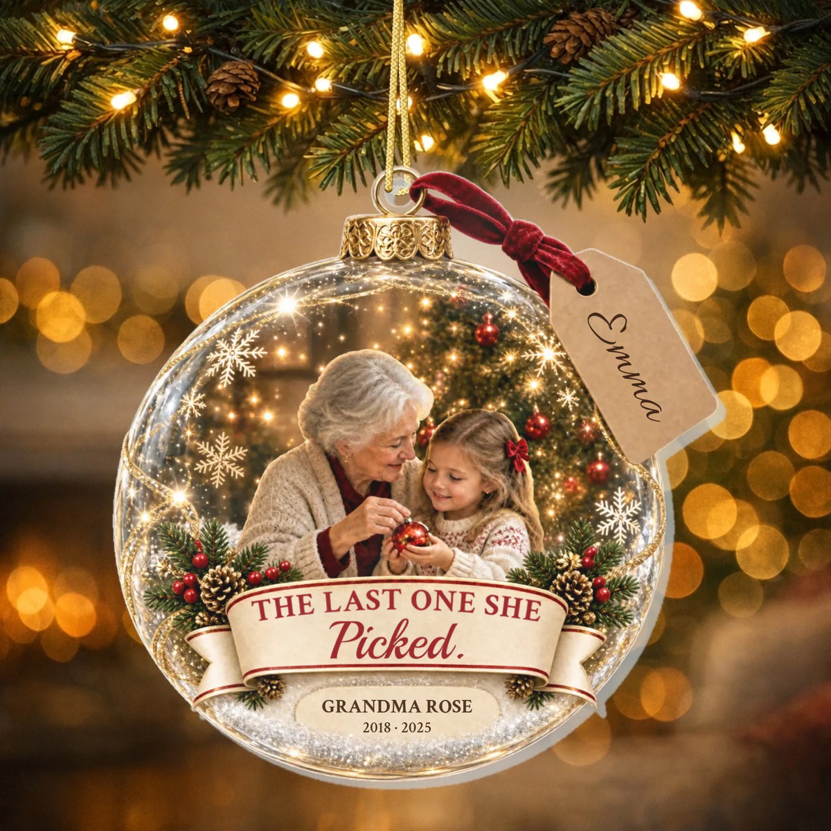 Personalized grandma memorial Christmas ornament with photo hanging on a lit tree