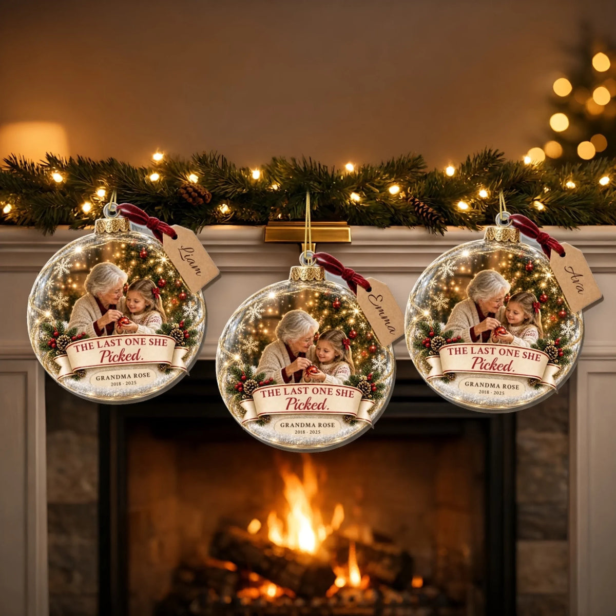 Three grandma memorial ornaments with different grandchild names on a mantel