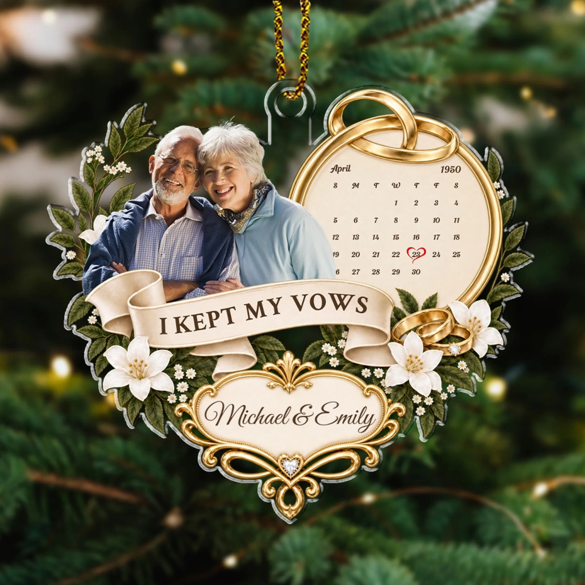 Couple photo anniversary ornament with wedding calendar hanging on pine branch