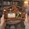 Hands holding horse memorial plaque with name, years and stall door quote
