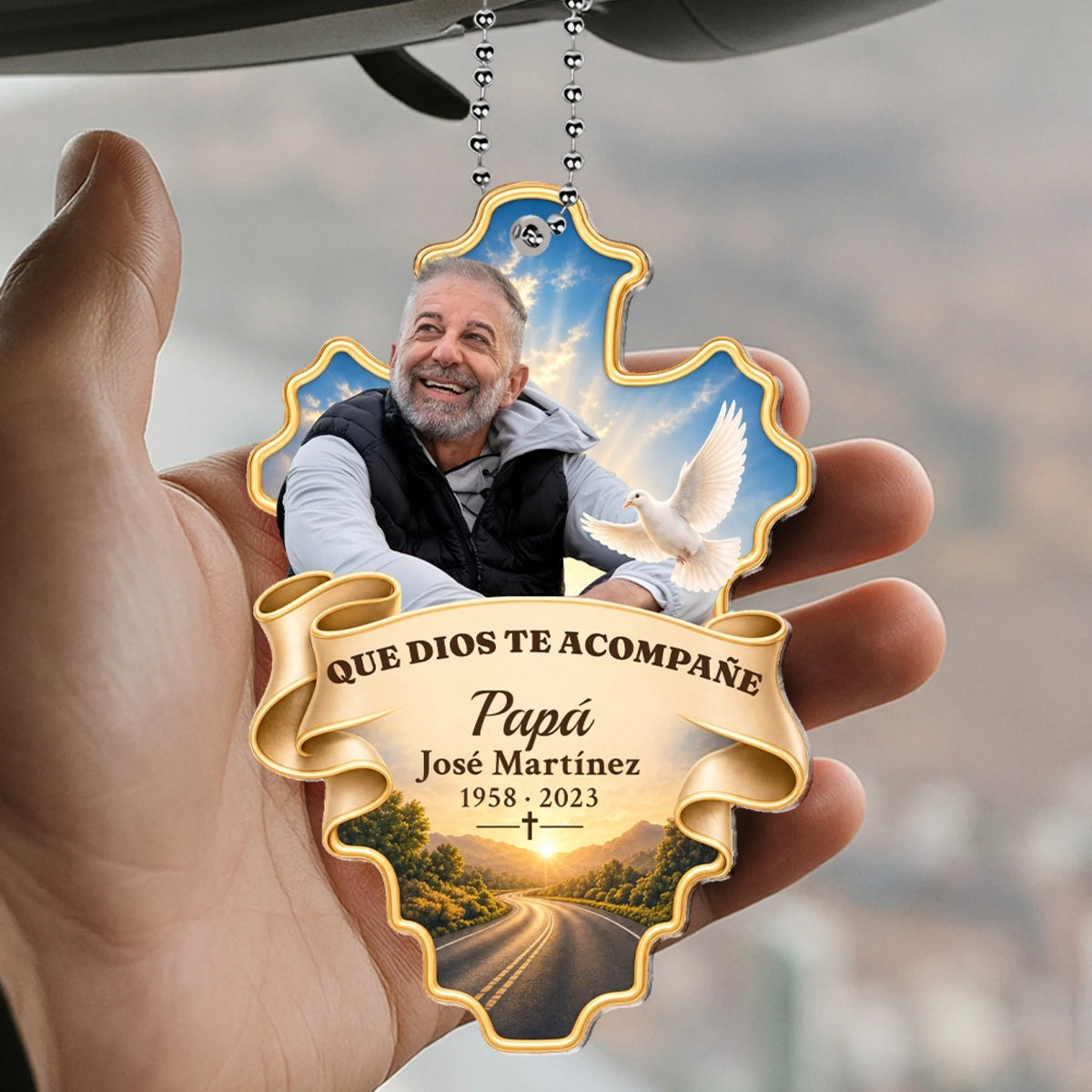 Hand holding Que Dios Te Acompañe dad memorial car hanger with dove