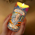 Hand holding glowing Spanish mom memorial candle with photo and name