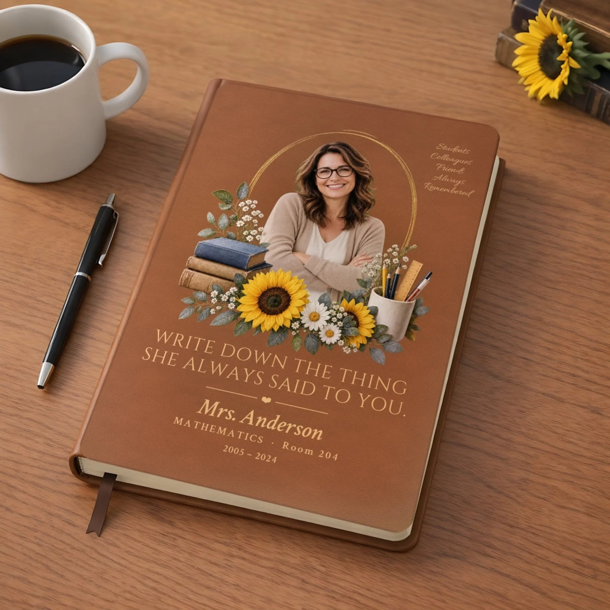 Personalized teacher memorial leather journal with photo on a desk