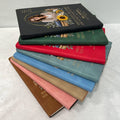 Stack of teacher memorial leather journals in eight cover colors