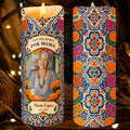 Front and back of Una Veladora Por Mamá memorial candle with marigolds