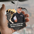 Hand holding coach memorial acrylic car hanger with photo, name and years