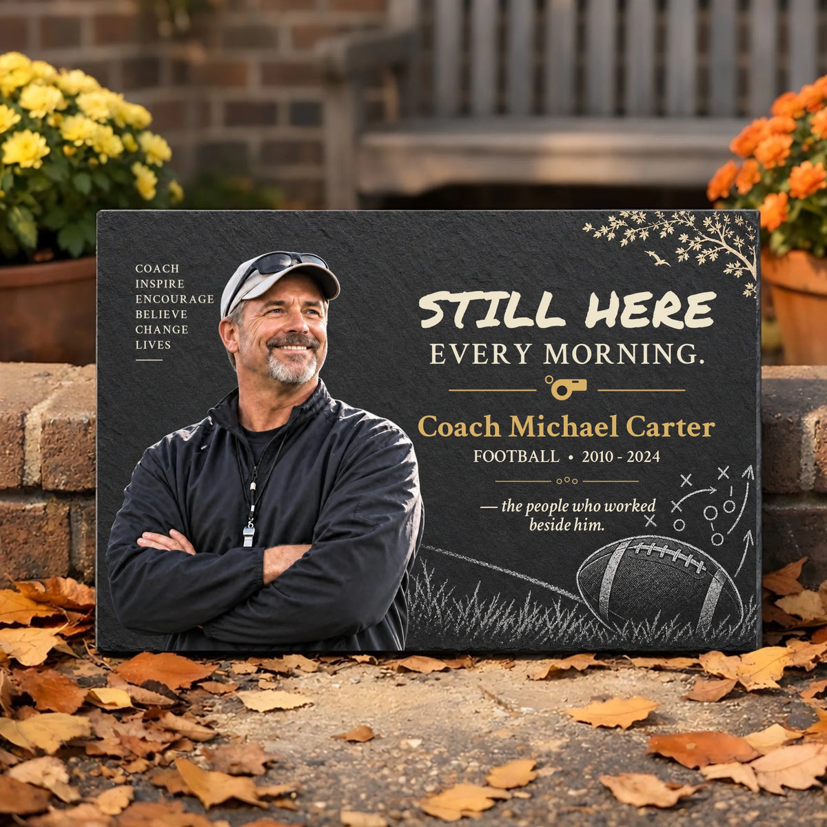 Personalized coach memorial garden stone with photo by autumn flowers and leaves
